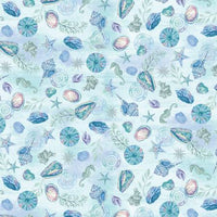 Light blue fabric featuring shells and seahorses, 100% cotton by Henry Glass, perfect for coastal-themed projects.