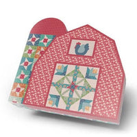 
              Hen House Quilt Kit displayed in a barn-shaped box featuring colorful fabric patterns and a rooster design.
            